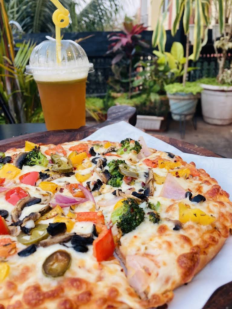 Pizza and a cold drink at The Big Oowl Cafe